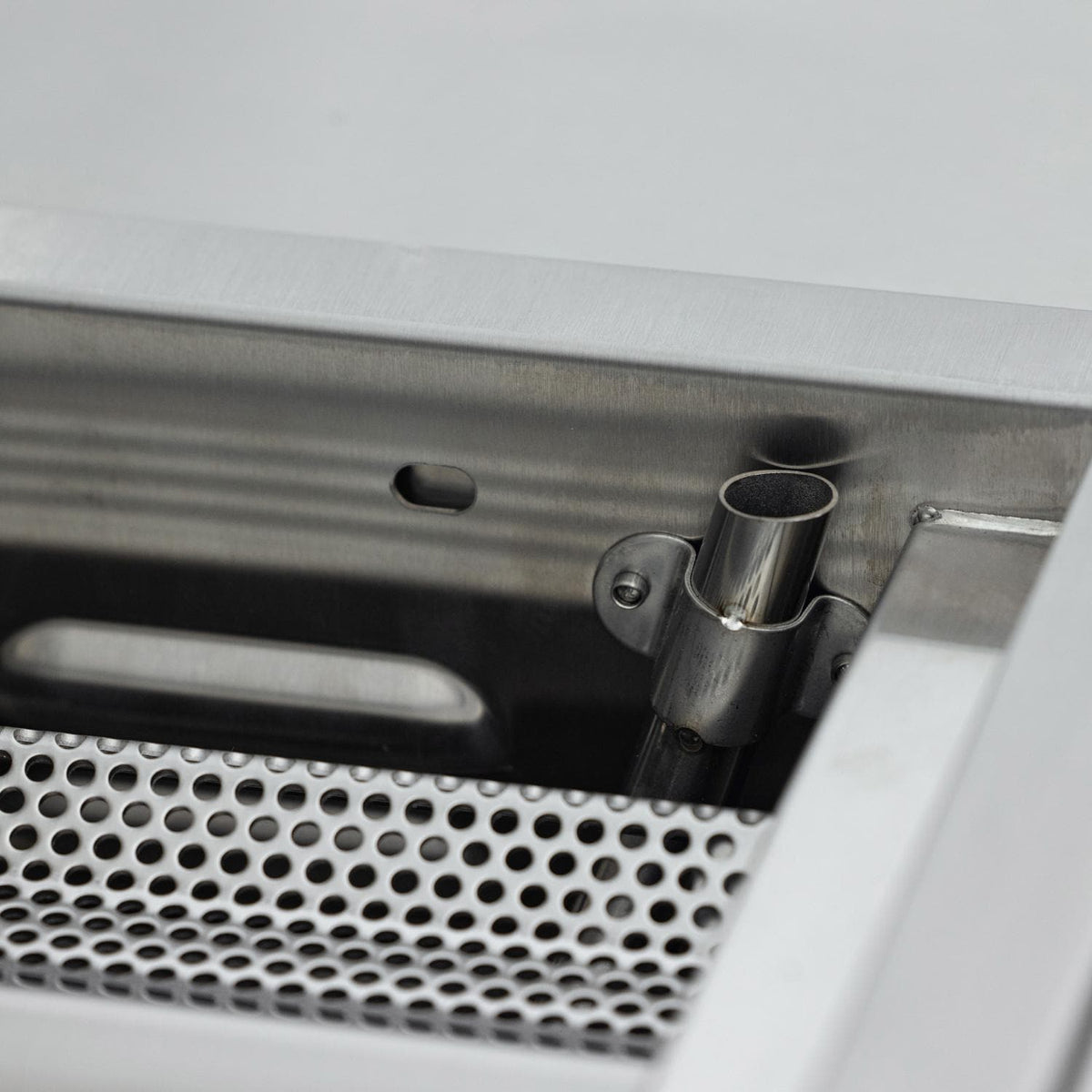 Close-up of a Blaze LTE PRO flash tube beside a perforated flame tamer