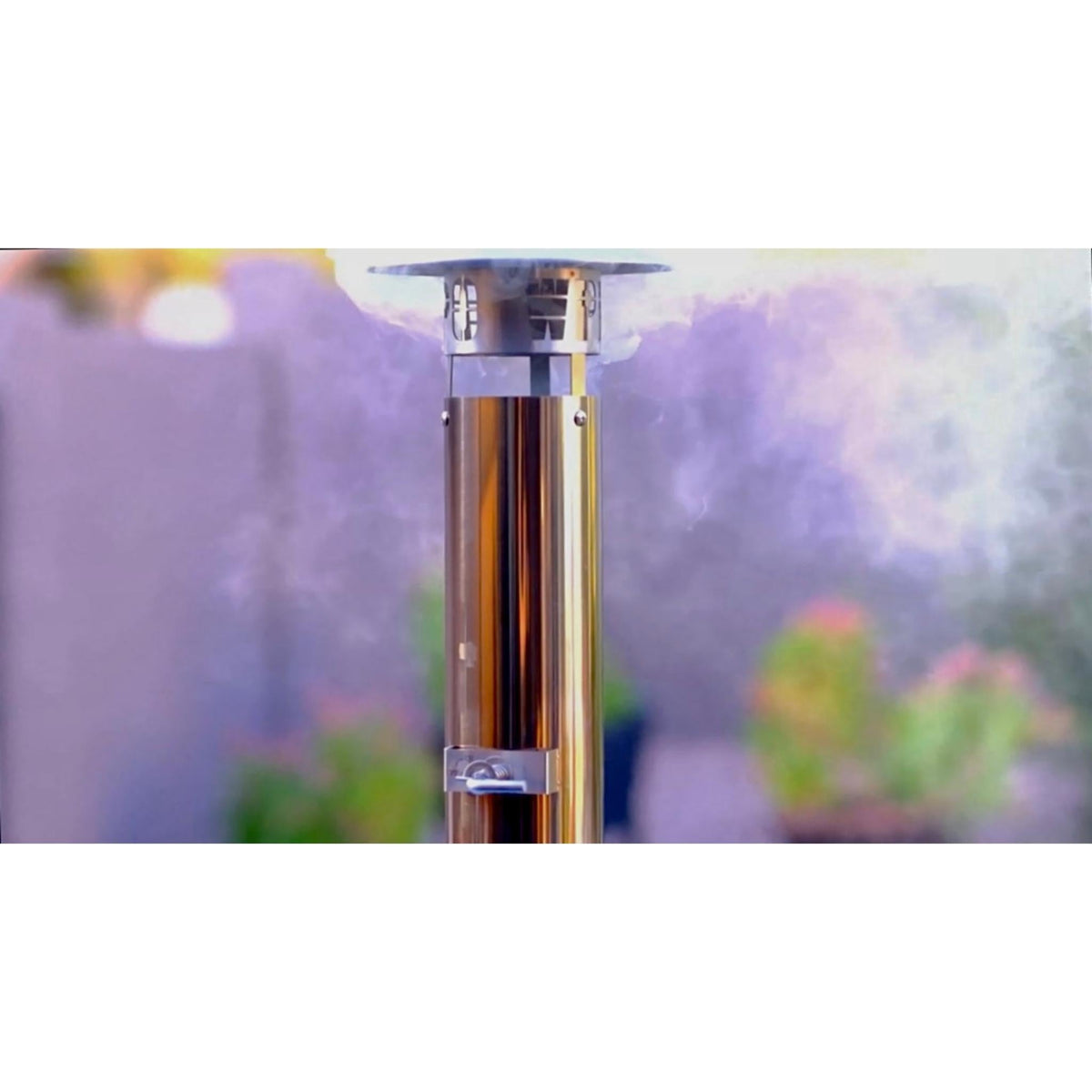 Close-up of the stainless-steel oven chimney showing its cap and side lever.