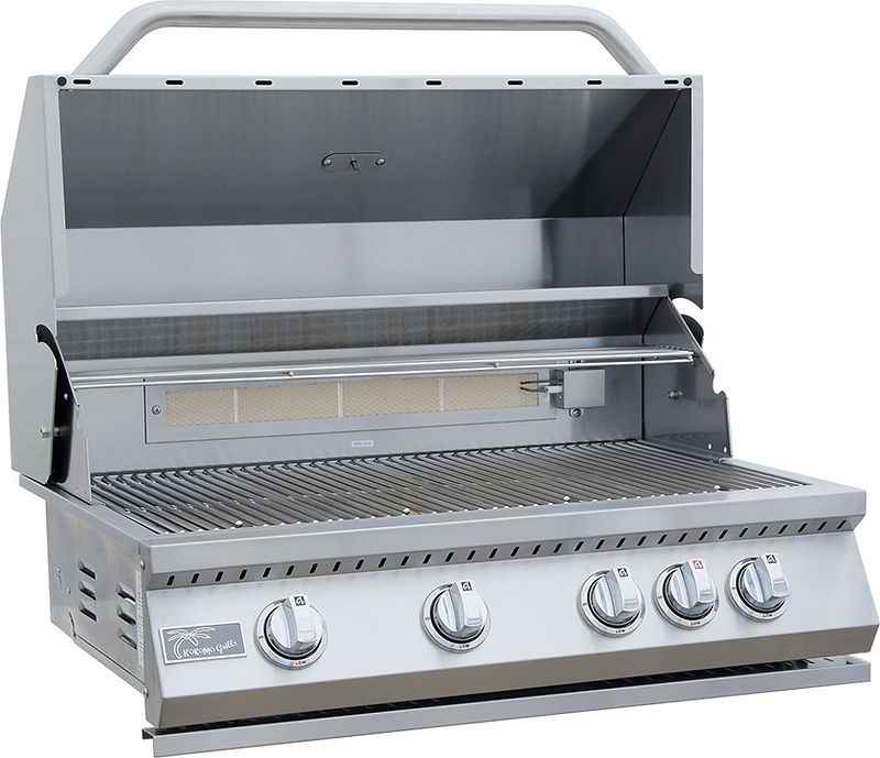 Open stainless steel Kokomo grill showing cooking grates, warming rack, rear burner and five control knobs.