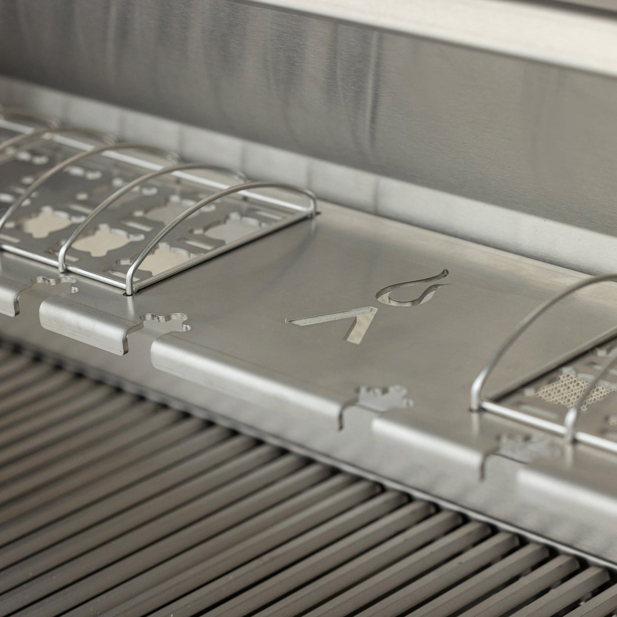 Blaze LTE PRO warming rack with taco holders and chicken-leg slots above the cooking grates