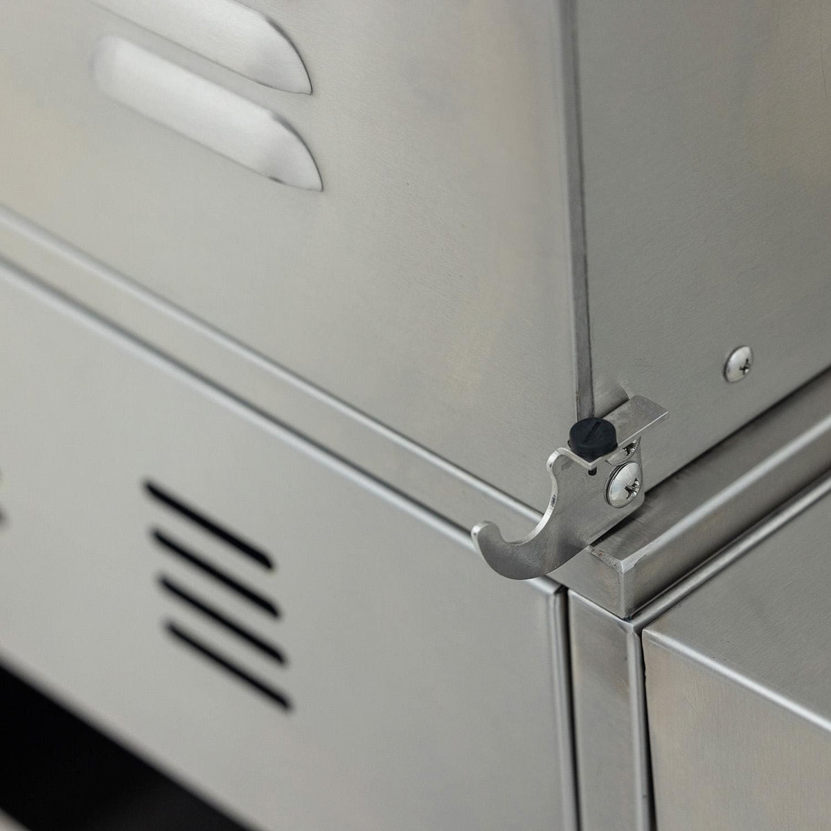 Close-up of the rotisserie rod support bracket on the side of the Blaze LTE PRO grill