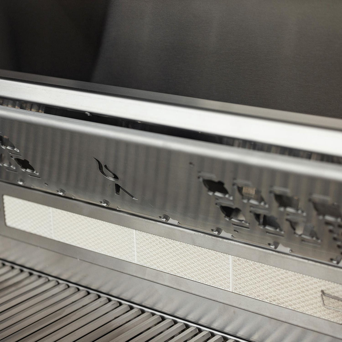 Blaze LTE PRO warming rack stored upright above the rear rotisserie burner