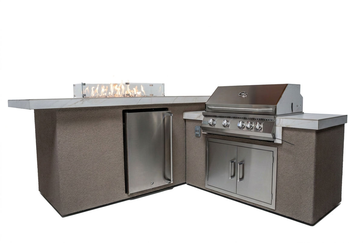 Kokomo L-shaped outdoor kitchen island with lit fire feature, refrigerator and closed stainless steel grill on a white background.
